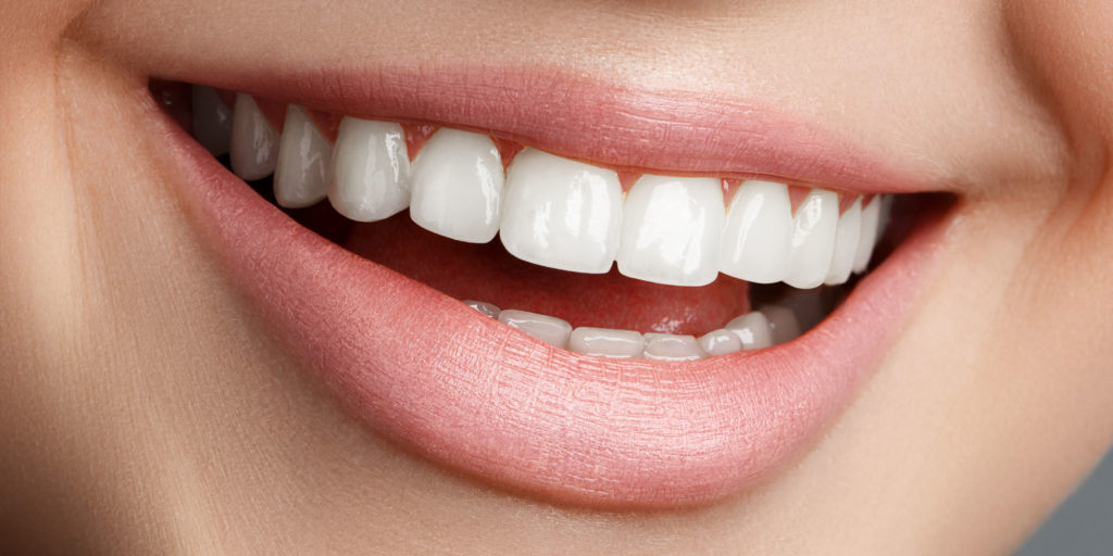 dental patient smiling after tooth colored fillings procedure Brooklyn, NY